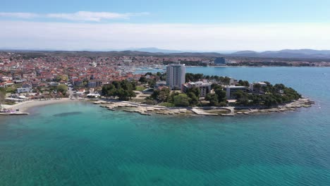 Aerial-View-On-Town-Of-Vodice-With-Amazing-Turquoise-Coastline-On-Adriatic-Coast-Of-Croatia---drone-shot