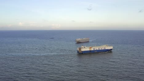Cargo-ship-leaving-port-toward-wide-open-sea