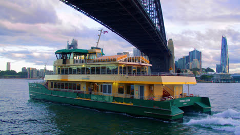 Ferry-Passes-Under-Sydney-Harbour-Bridge-In-Sydney,-Australia---POV