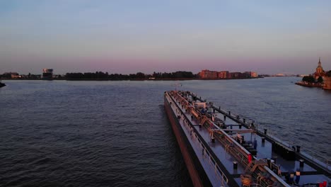 Inland-Tanker-Ship-Going-Past-Along-Oude-Maas-During-Twilight-Hours-In-Dordrecht