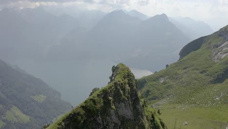 Young-man-hikes-at-Klingenstock-with-a-beautiful-view-over-VierwaldstÃ¤tterlake,-Lucerne,-Switzerland