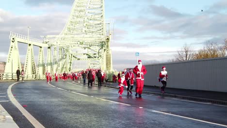 Slow-motion-Charity-Santa-dash-community-fun-run-across-Runcorn-Silver-Jubilee-bridge