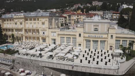 Aerial-View-Of-Hotel-Kvarner-Balcony-With-Chairs,-Tables-And-Cocktail-Tables-Set-Up-For-Party-In-Opatija,-Croatia