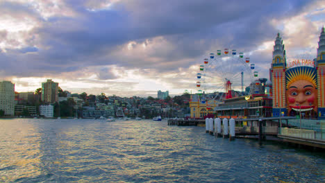 Luna-Park,-Waterfront-Amusement-Park-With-Skyline-And-Port-Jackson-View-In-Sydney,-NSW,-Australia