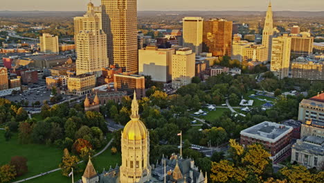 Hartford-Connecticut-Aerial-v16-birds-eye-view-overlooking-at-golden-sunset-reflection-on-state-capitol-building-and-downtown-high-rise-cityscape---Shot-with-Inspire-2,-X7-camera---October-2021