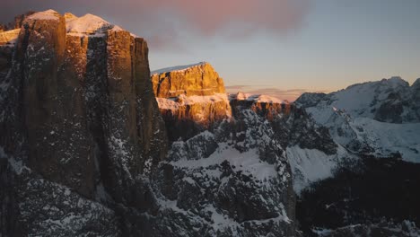 Drones-rise-over-the-gold-snowcapped-Dolomites