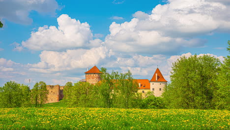 medieval-Bauska-castle-and-garden-in-Latvia,-Europe,-in-a-summer-day