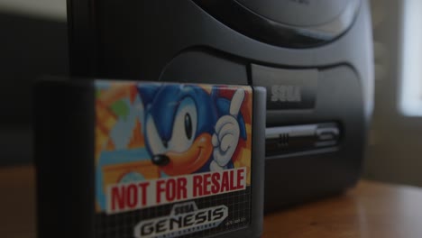 Rack-Focus-Close-Up-of-a-Sega-Genesis-and-a-Sonic-the-Hedgehog-Game-Cartridge