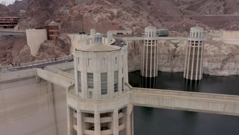 Aerial-view-of-the-Hoover-Dam-and-the-intake-towers-with-traffic-on-the-bridge