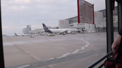Terminal-Shuttle-Bus-in-Frankfurt-Airport-FRA-with-Lufthansa-Planes-Parked