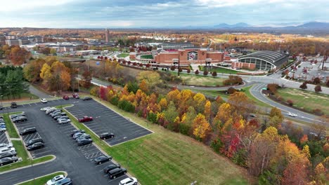 Wide-aerial-approach-of-Liberty-University-during-colorful-autumn-fall-foliage