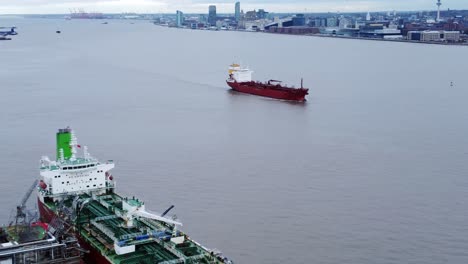 Silver-Rotterdam-oil-petrochemical-shipping-tankers-loading-at-Tranmere-terminal-Liverpool-aerial-view-zoom-in