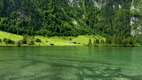 Beautiful-green-mountains-and-crystal-clear-natural-lake-during-sunny-day-in-Alps-of-Germany---Idyllic-nature-with-panorama-view