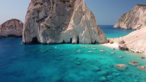 The-remote-and-beautiful-beach-of-Mizithres-at-the-west-coast-of-Zakynthos-island,-Greece,-with-crystal-clear-sea-during-summer-time
