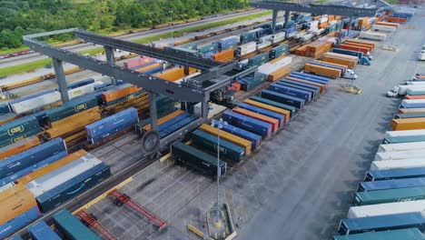 4K-Drone-Video-of-Trains-and-Trucks-at-CSX-Intermodal-Train-Yard-in-Winter-Haven,-FL