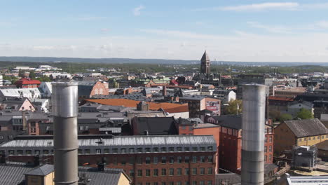 Norrkoping,-Sweden---Aerial-View-Of-Skyline-Past-Industrial-Chimneys