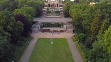 Gorgeous-aerial-drone-flight-slowly-rise-up-drone-shot-in-a-Park-in-summer