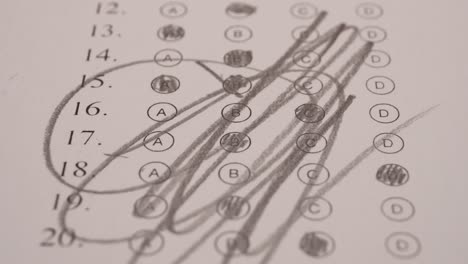 Student-Scribbling-Multiple-Choice-Test-Bubble-Sheet-With-Pencil