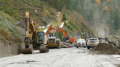 -Landslide-clearing-activities-on-the-side-of-the-mountains-using-heavy-equipment