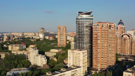 Aerial-drone-video-of-downtown-apartment-buildings-and-cars-on-the-highway-in-Pecherskyi-district-of-Kyiv-Oblast-Ukraine-during-sunset