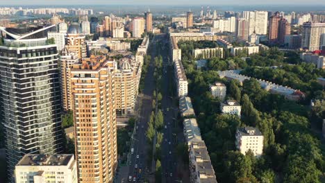 Aerial-drone-video-of-downtown-skyline-buildings-and-cars-on-the-highway-in-Pecherskyi-district-of-Kyiv-Oblast-Ukraine-during-sunset