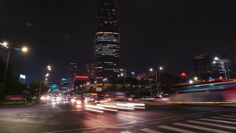 Night-Seoul-city-Lights---Lotte-World-Tower-in-Jamsil-district-and-fast-cars-light-trails-on-crossroads