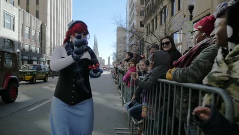Slow-Motion-Cosplay-Ariel-From-Little-Mermaid-Waves-At-Crowd-And-Hi-Fives-African-American-Children-Kids-At-Tulsa-Christmas-Parade-Stock-Video-Footage-#1