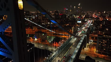 Cinematic-aerial-descending-shot-of-Ben-Franklin-bridge-in-Philly