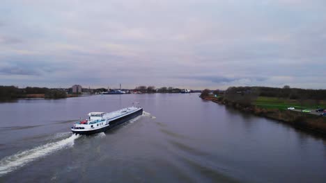 Aerial-View-Of-Stern-Inland-Liquid-Tanker-Travelling-Along-Oude-Maas-Through-Zwijndrecht