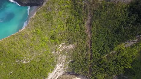 Amazing-aerial-view-flight-tilt-down-drone-flight-edge-cliff-to-Untouched
big-wave-magic-beach-Nusa-Penida-in-Bali-Indonesia-is-like-Jurassic-Park
