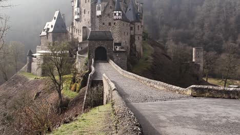 The-majestic-Eltz-Castle-with-a-stunning-sunrise-glow-illuminating-the-impressive,-ancient-building