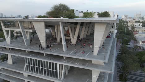 Rotating-aerial-of-parkade-rooftop-garden-and-exercise-class-in-Miami