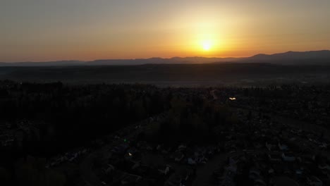 Orbiting-aerial-of-the-sunrise-over-the-Cascade-Mountain-Range