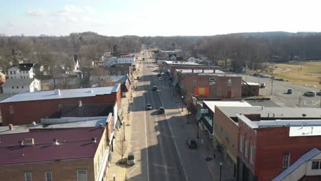 Downtown-Nashville,-Michigan-drone-video-going-backwards
