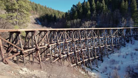 Drone-aerial-fly-by-of-an-old-historic-railroad-track-bridge