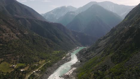 Aerial-View-Over-River-Running-Through-Swat-Valley-Floor