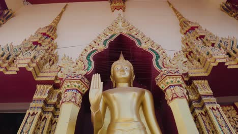 Golden-Buddha-statue-at-the-Wat-Plai-Laem-temple-in-Koh-Samui-zoom-close-up-shot
