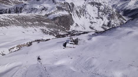 Aerial-View-of-Ski-Slope-in-the-French-Alps-with-Chairlifts--Dolly-In-Shot---Shot-in-Tignes-and-Val-d'Isere