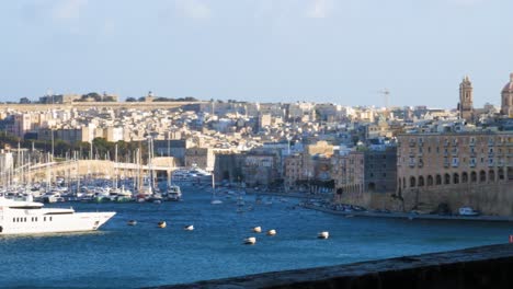 Superyacht-moored-in-harbor-of-Valletta,-Malta-island