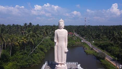 Drone-shot-of-Giant-Buddha-Statue-in-Peraliya,-Sri-Lanka