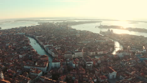 Cinematic-descending-drone-shots-towards-Ponte-dell-accademia-and-Venice-Basilica-at-sunrise