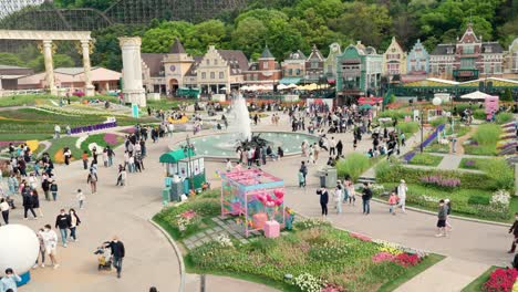 Crowds-enjoying-the-grounds,-gardens,-shops-and-rides-at-the-Everland-Amusement-Park-in-Korea