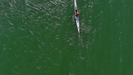 Birds-eye-view-of-a-person-kayaking-at-Lagoon-Beach-in-Cape-Town-South-Africa