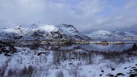 Low-aerial-revealing-shot-on-a-scenic-winter-day,-Sildpollnes-in-Lofoten,-Norway