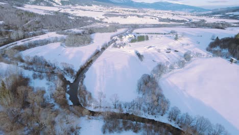 aerial-view-of-sunny-winter-snow-landscape-in-tatra-national-park-slovakia,-fresh-white-snow-ski-resort-town