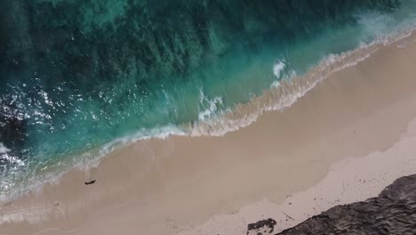 Aerial-Birds-Eye-Over-Waves-Breaking-On-Diamond-Beach-At-Nusa-Penida
