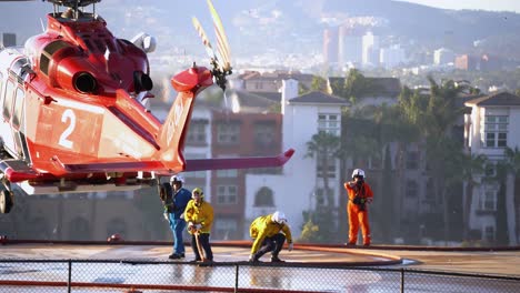 Rescue-Helicopter-landing-at-the-Fire-department-station,-in-sunny-Los-Angeles,-USA