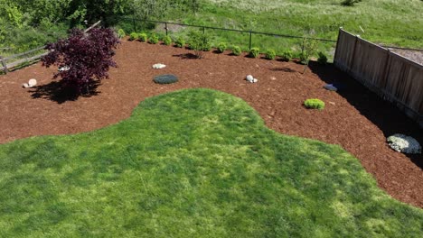 Aerial-of-a-fresh-bed-of-bark-in-a-landscaped-backyard