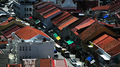Close-up-time-lapse-of-a-small-street-in-the-Little-India-area-in-Singapore-with-traffic-and-people-speeding-around
