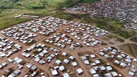 Birds-Eye-View-of-Village-in-Africa,-Dirt-Roads-with-Houses